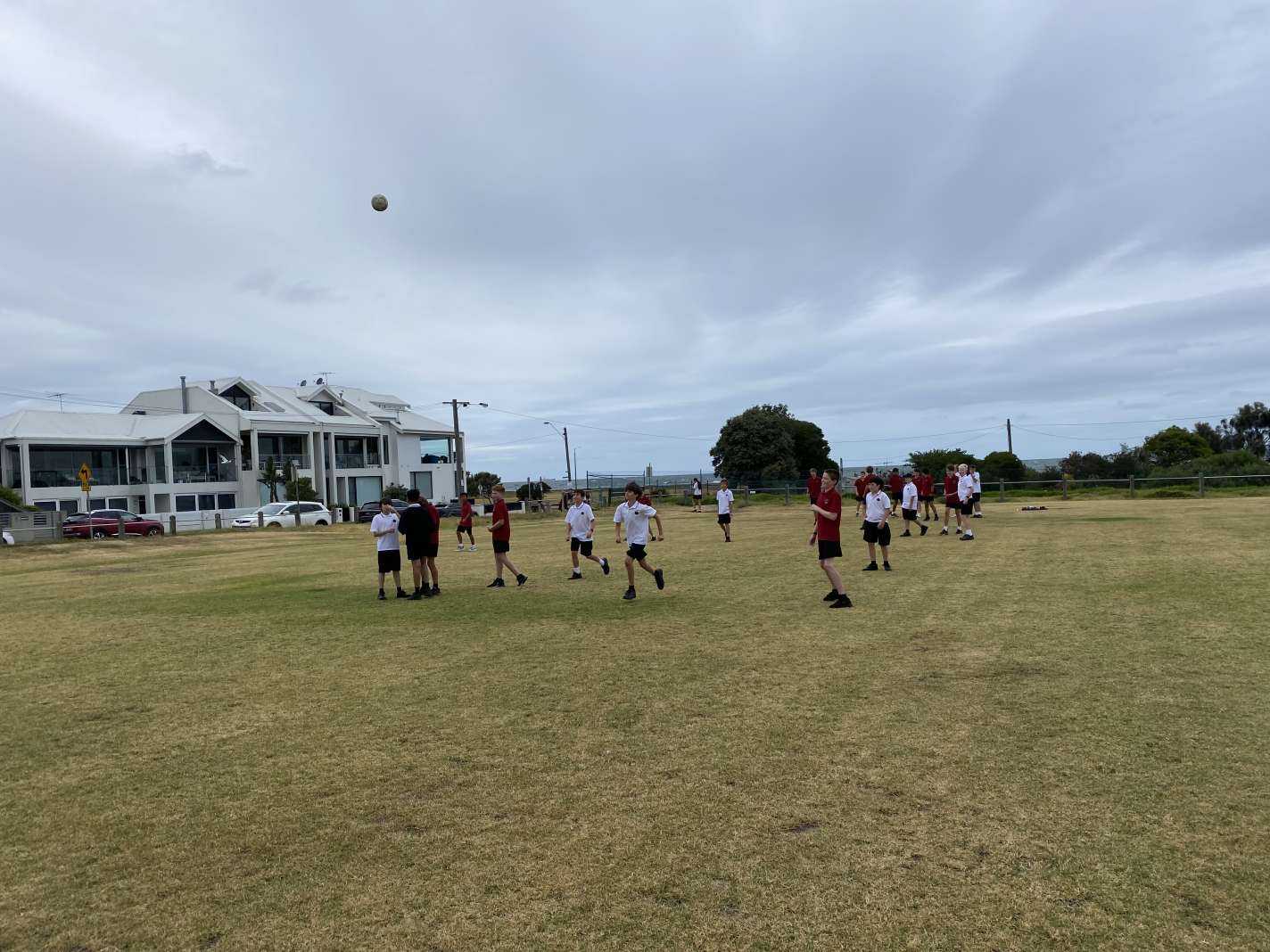 year 7s playing soccer on the oval