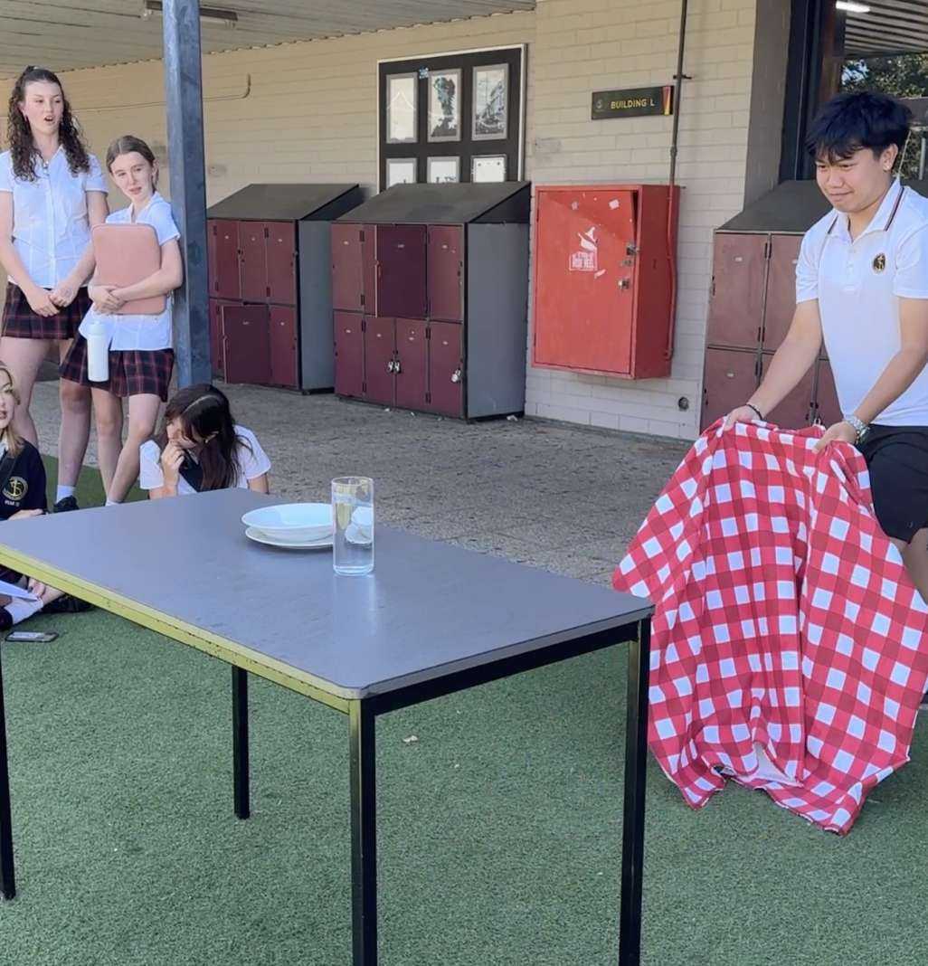 Oscar Nguyen pulling of the Table Cloth trick