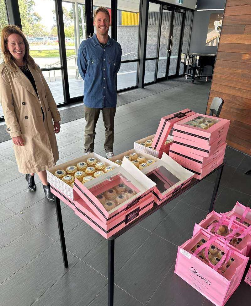 Ms Hall and Mr Rodda ready to handout WHS cupcakes to students after their final theatre assembly