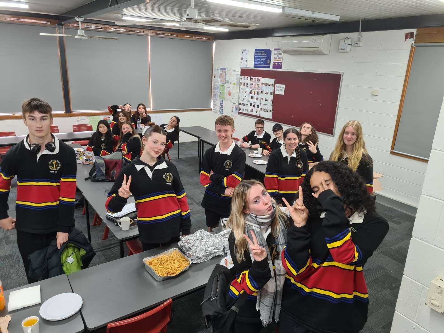 11F enjoying their Hot Wings lunch after winning the Semester Two Homegroup Challenge