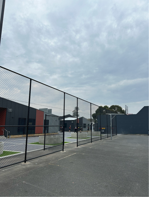 Photo of cyclone fence installed along the basketball court