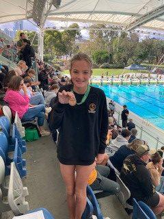 Bonnie proudly displaying her medal